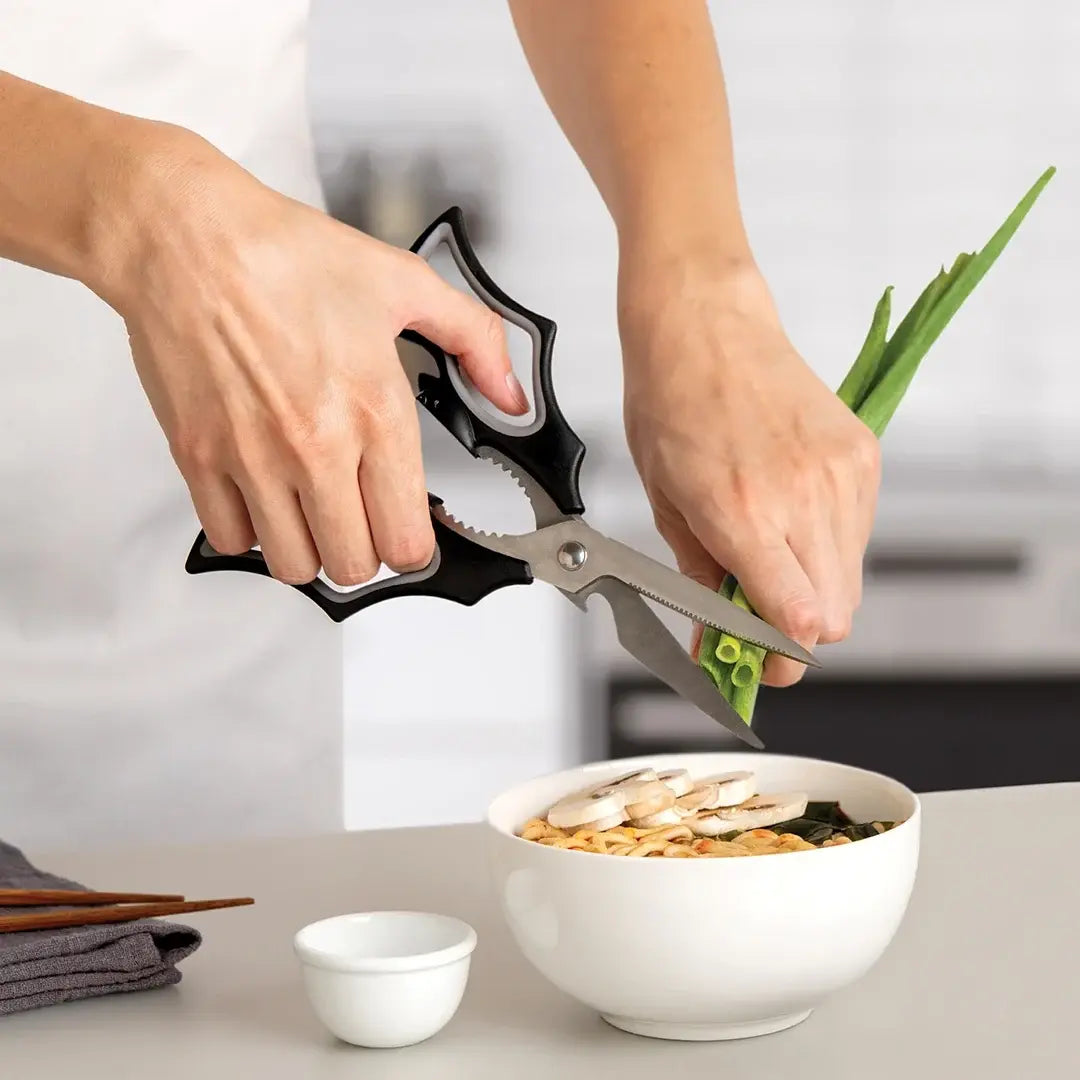a person cutting vegetables into a bowl