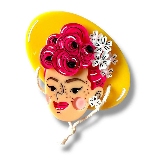 a yellow hat with a woman's face