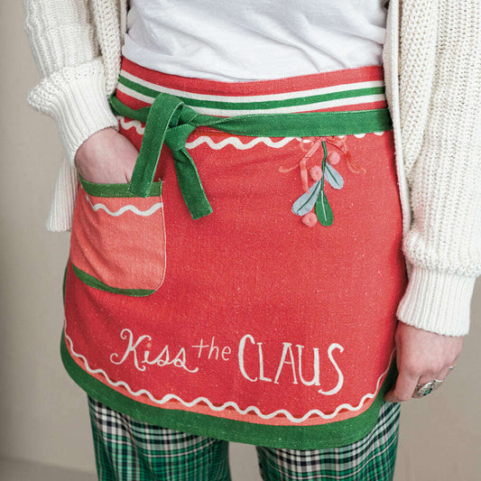 a person wearing a red and green apron