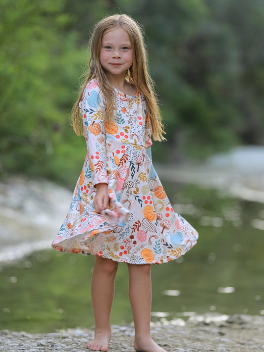 a girl standing on a rock near water