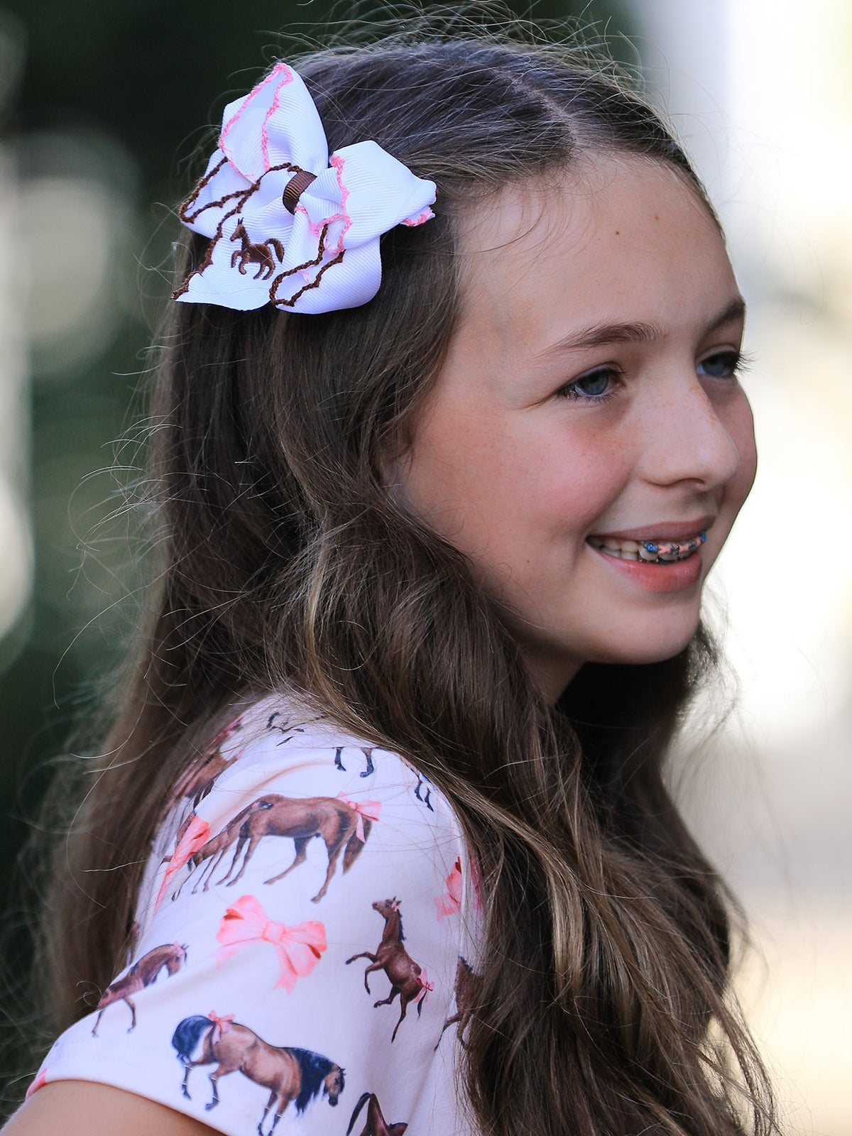 a girl with braces in her hair