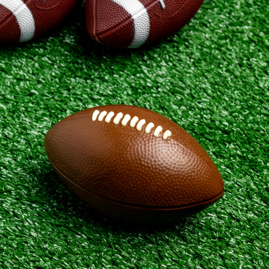 a football on a green surface