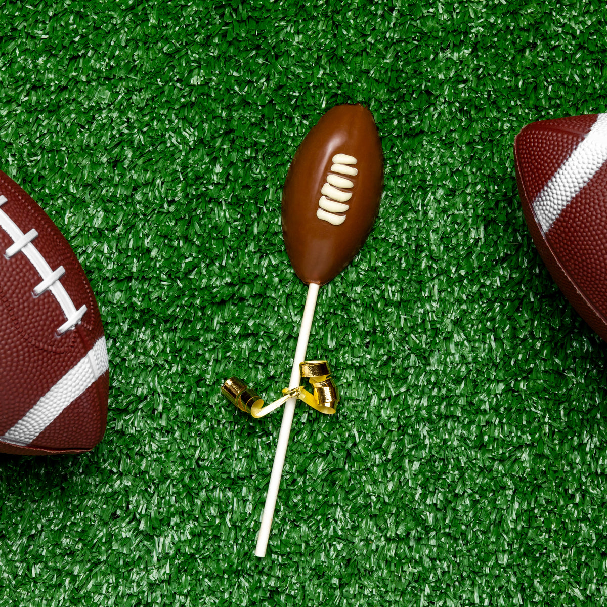 a chocolate football on a stick