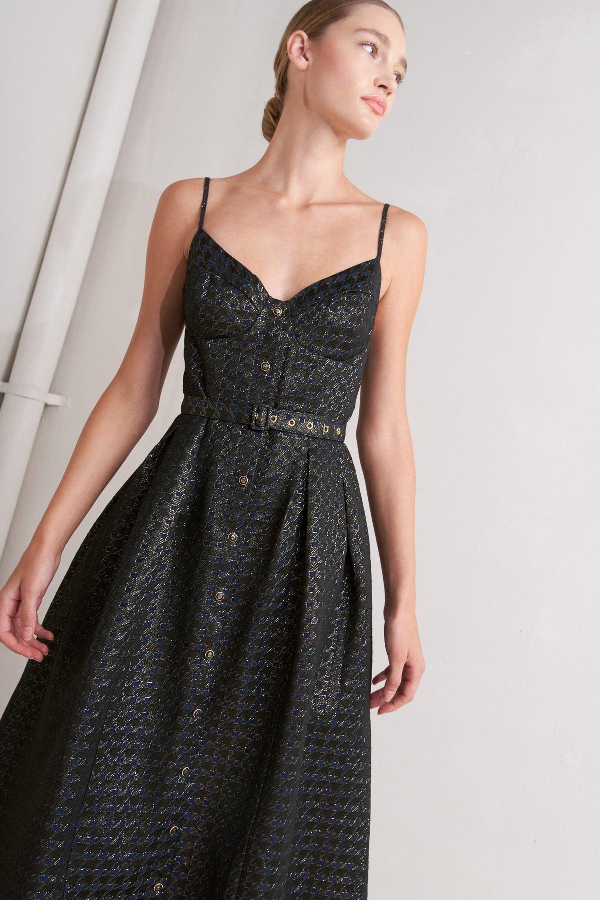 a woman wearing a black dress