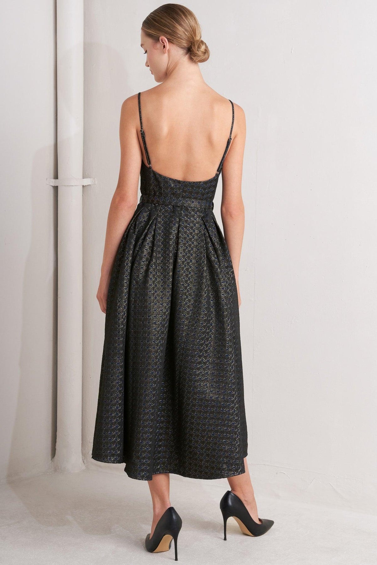 a woman in a black dress