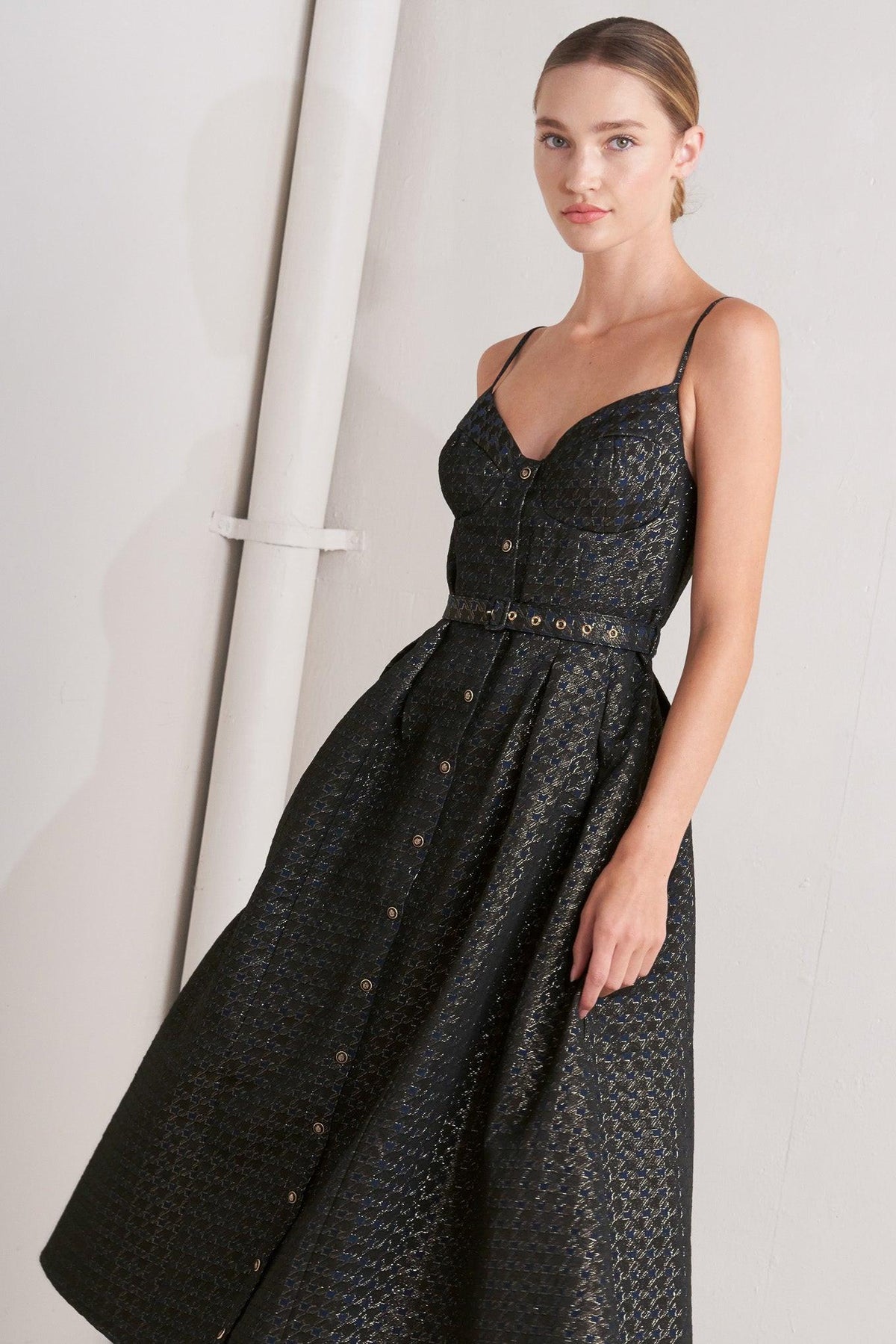 a woman in a black dress
