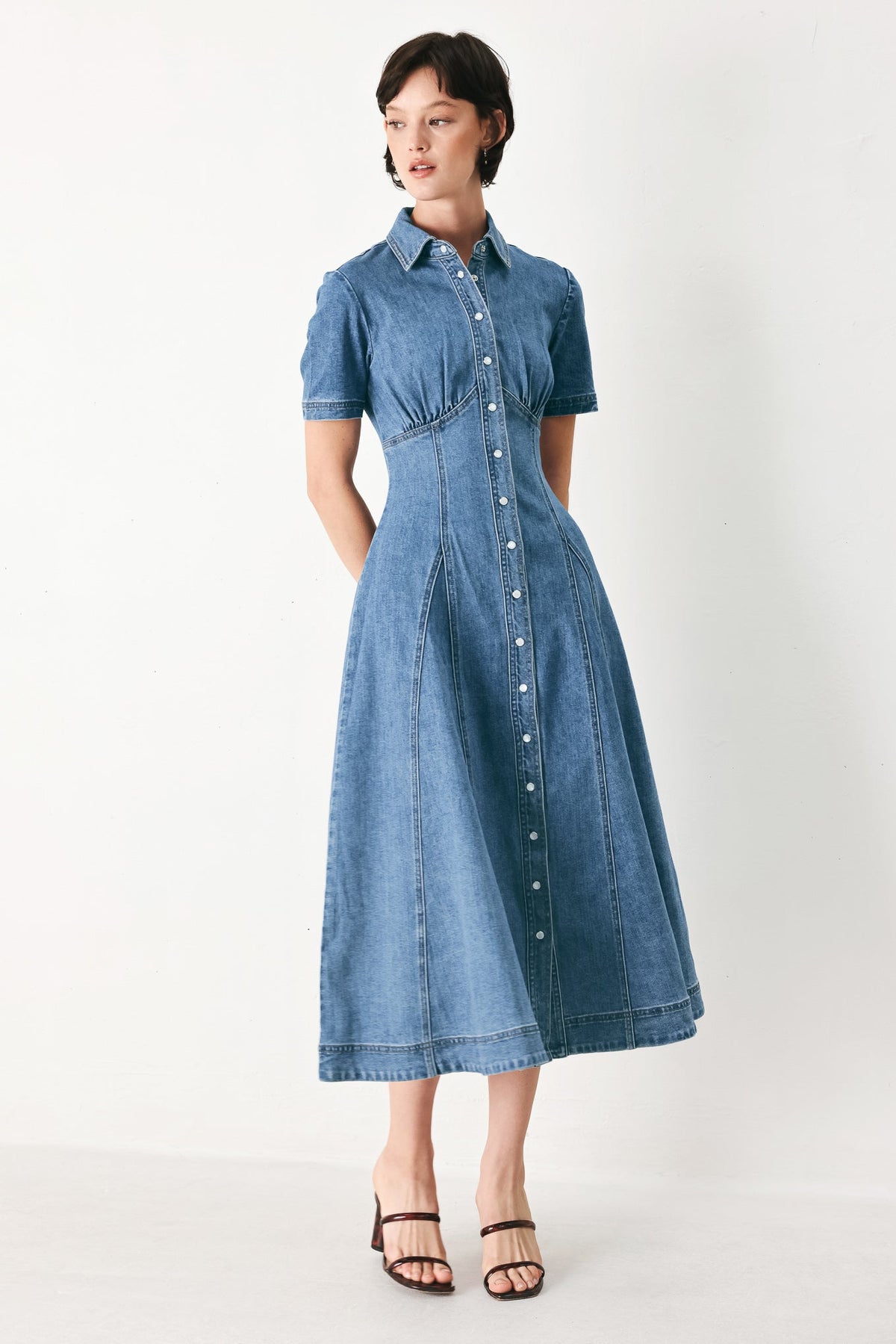 a woman in a denim dress