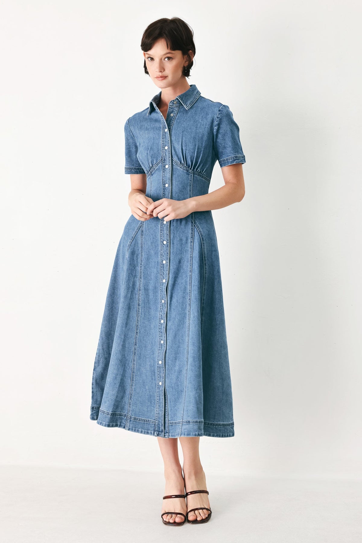 a woman in a denim dress