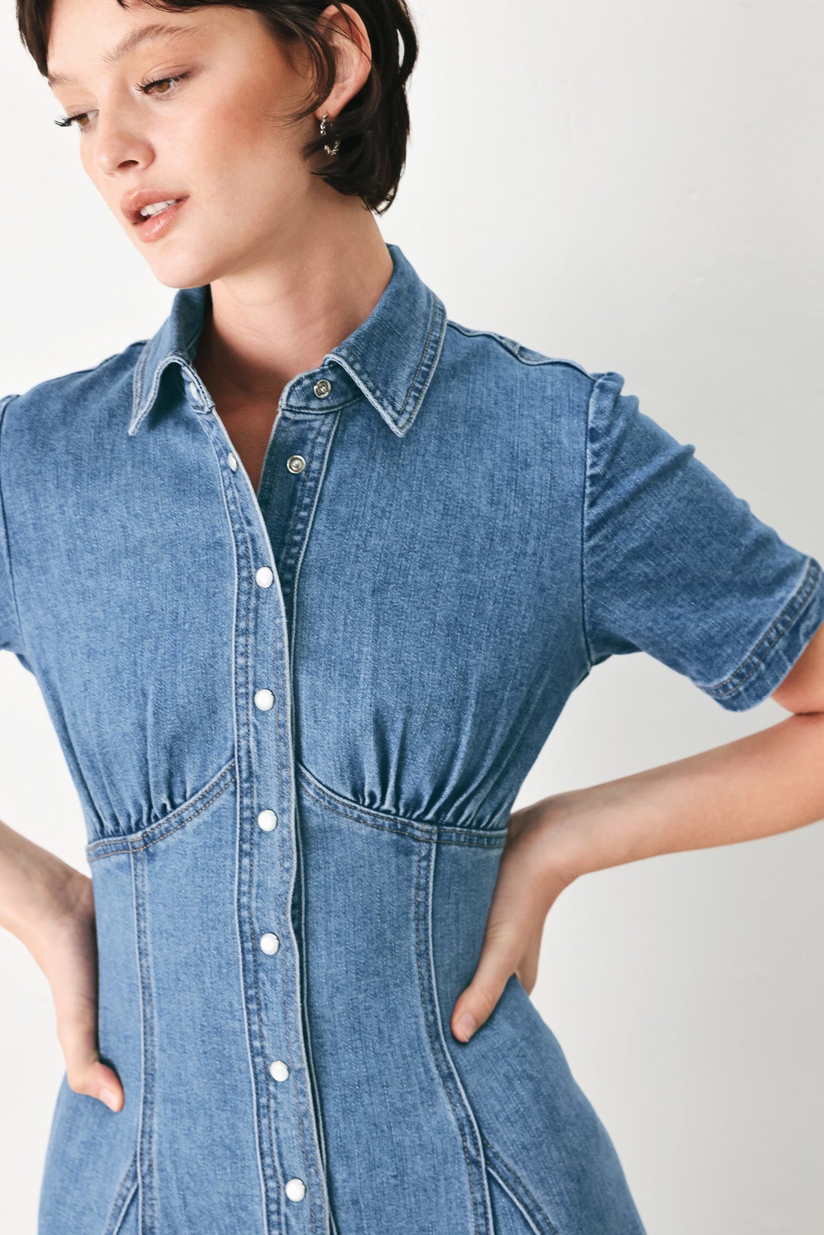 a woman in a denim dress