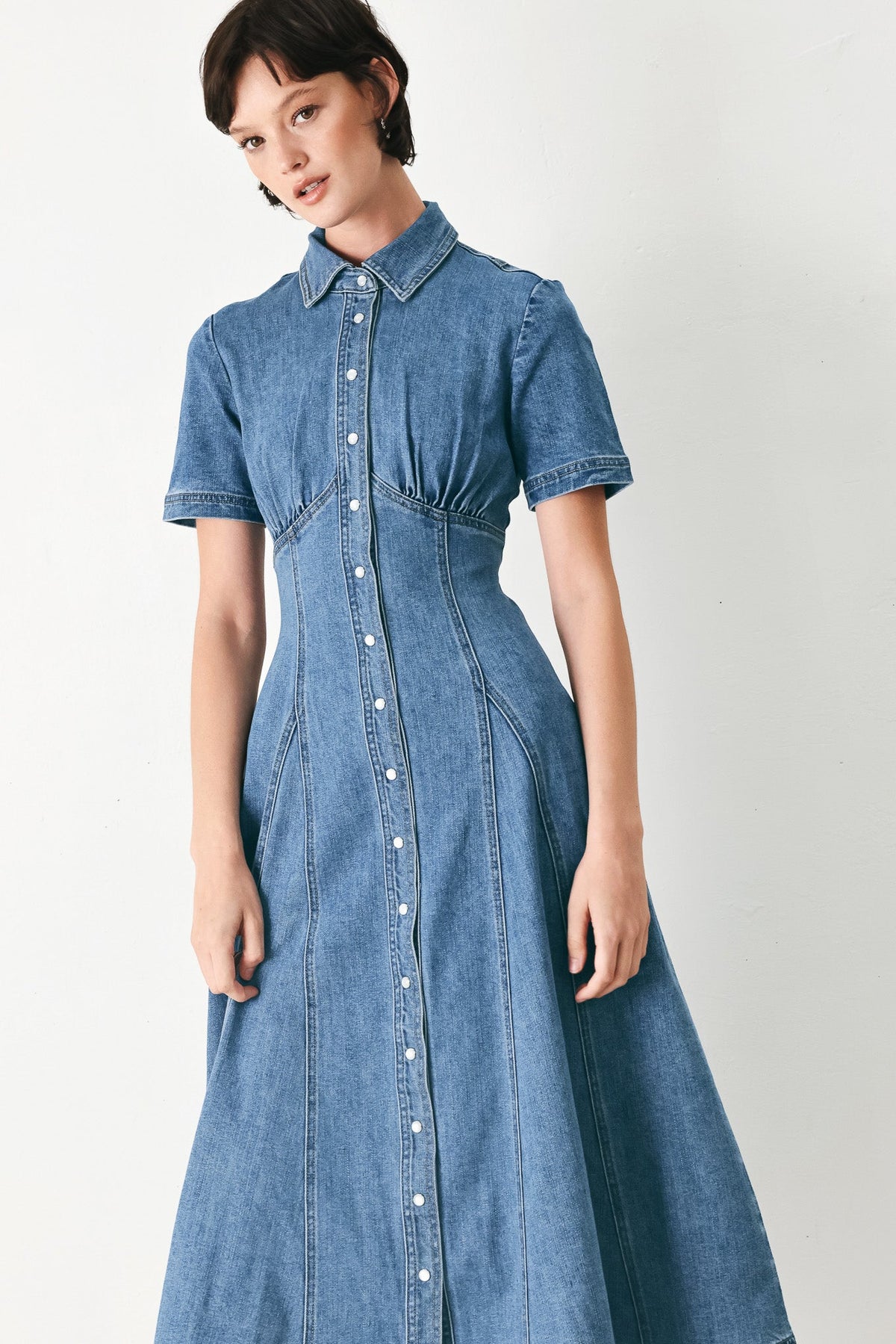 a woman in a denim dress