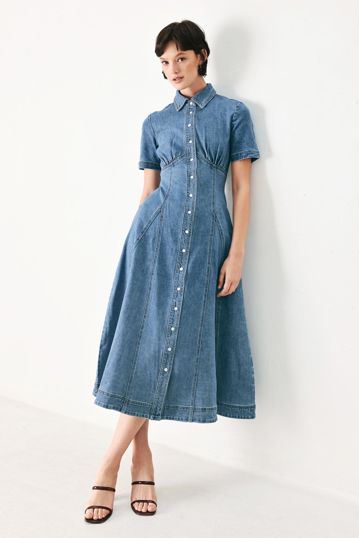 a woman in a denim dress