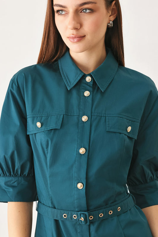 a woman wearing a green shirt