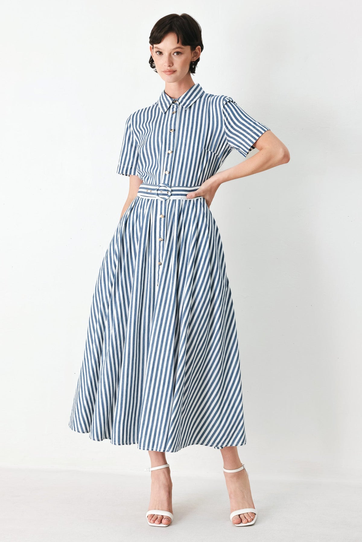 a woman in a striped dress