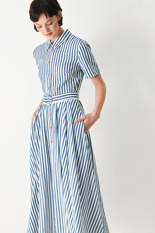 a woman in a striped dress