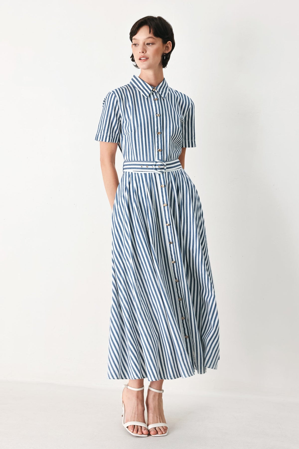 a woman in a striped dress