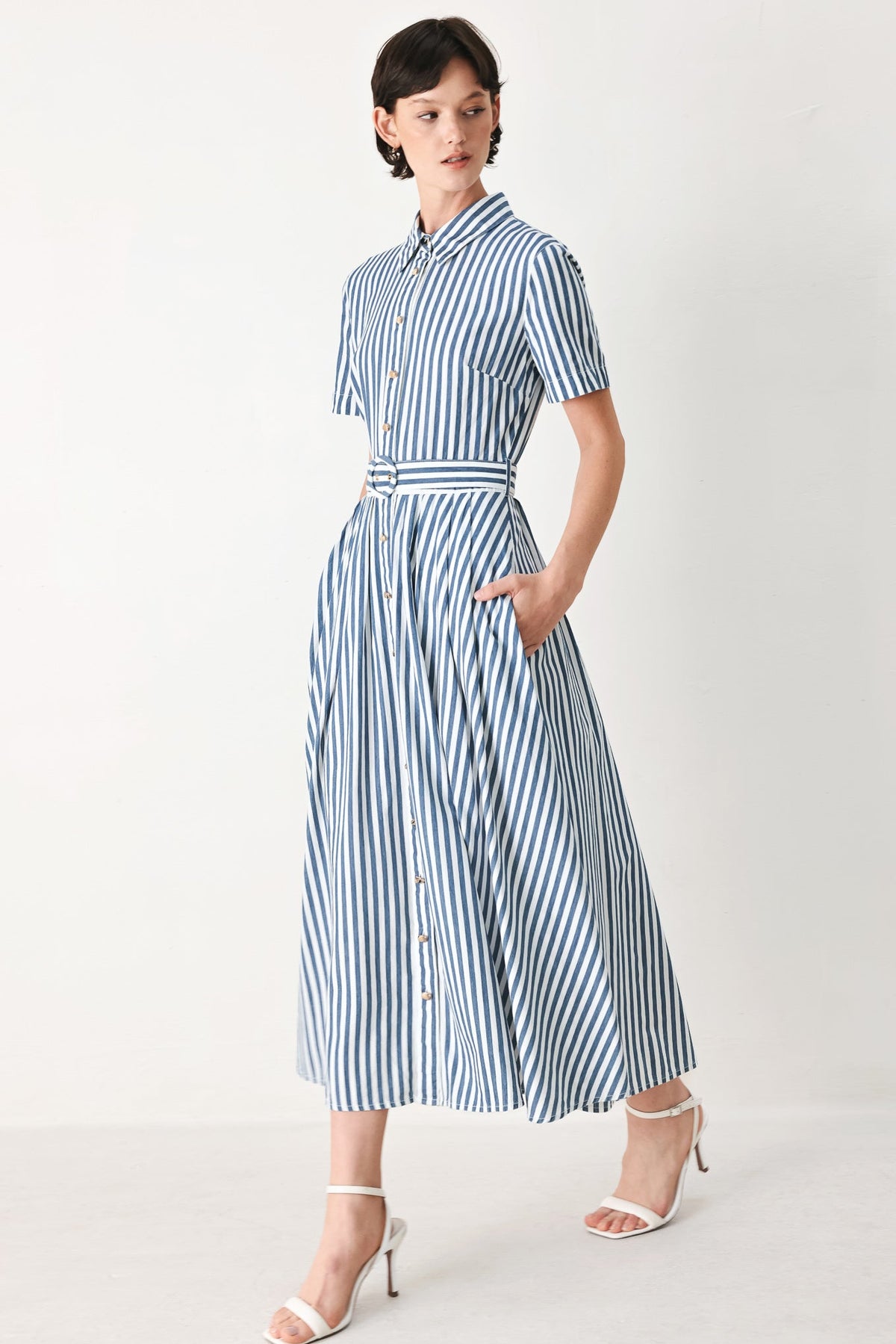 a woman in a striped dress