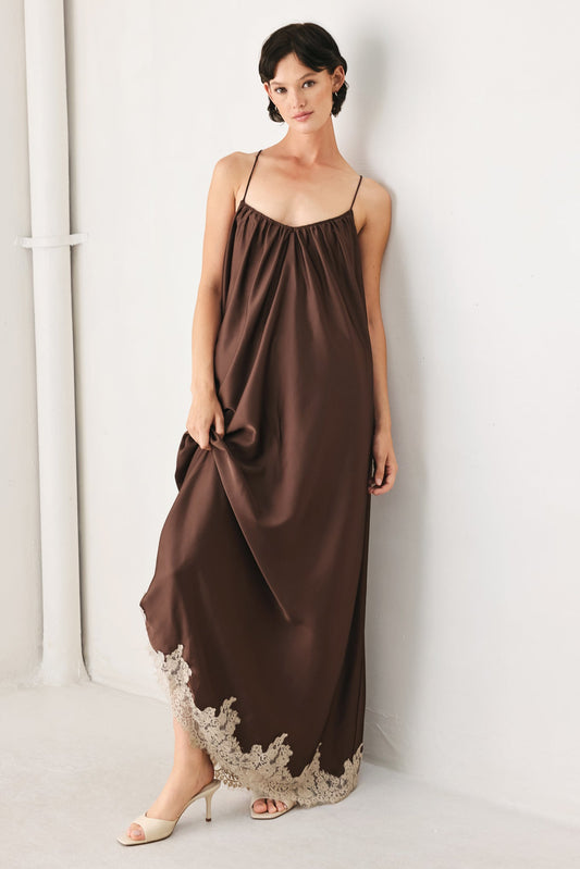 a woman in a brown dress