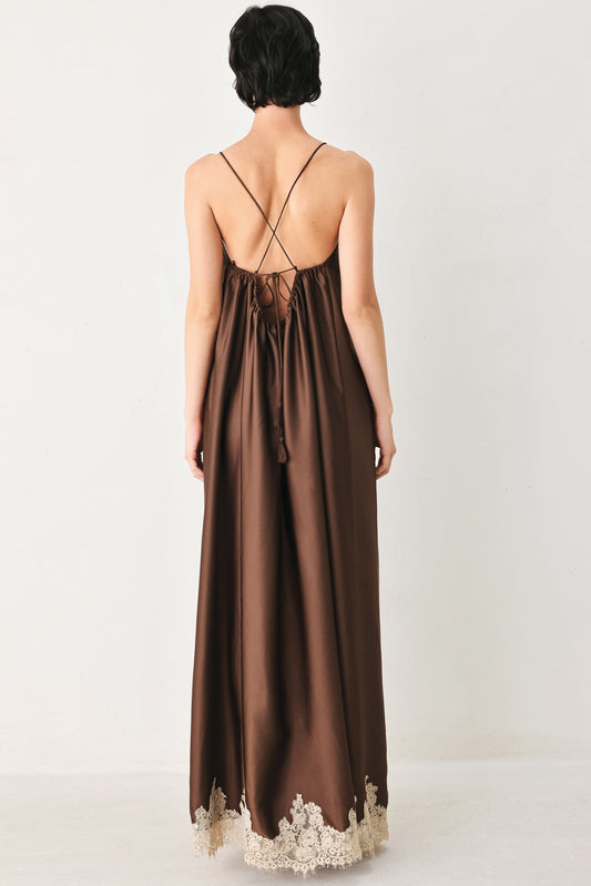 a woman in a brown dress