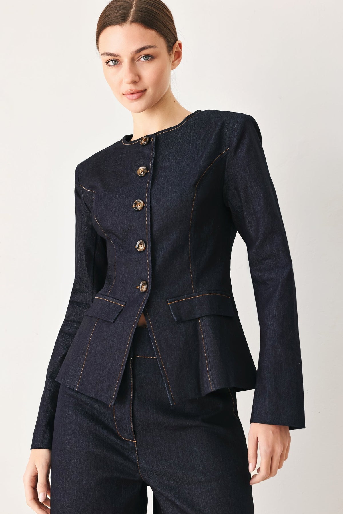 a woman in a black suit