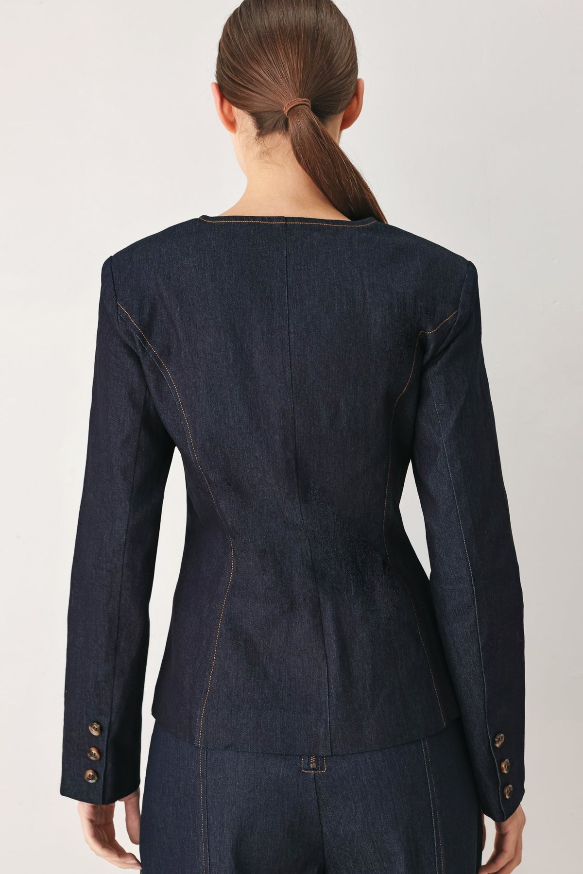 a woman in a blue jacket