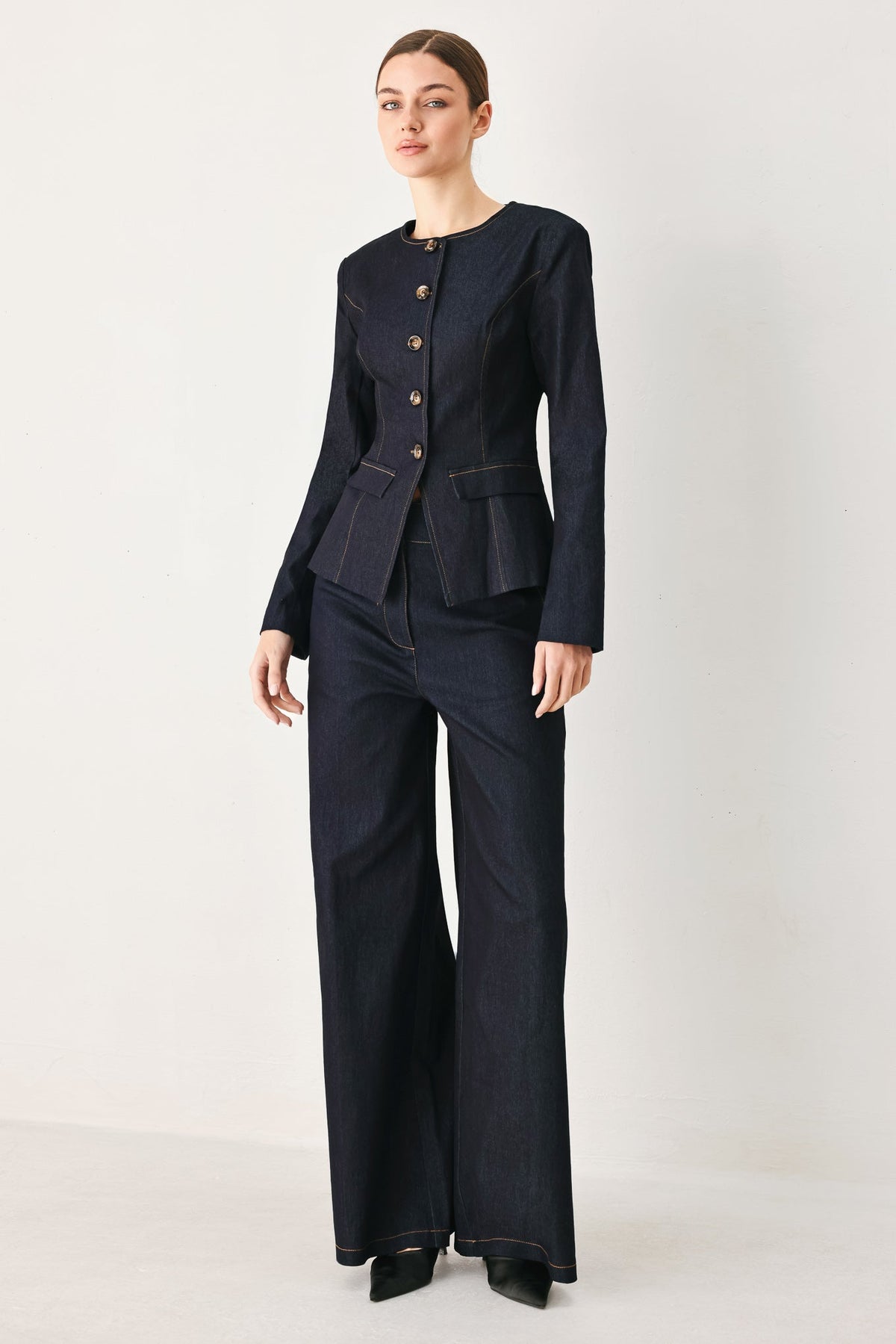 a woman in a black suit