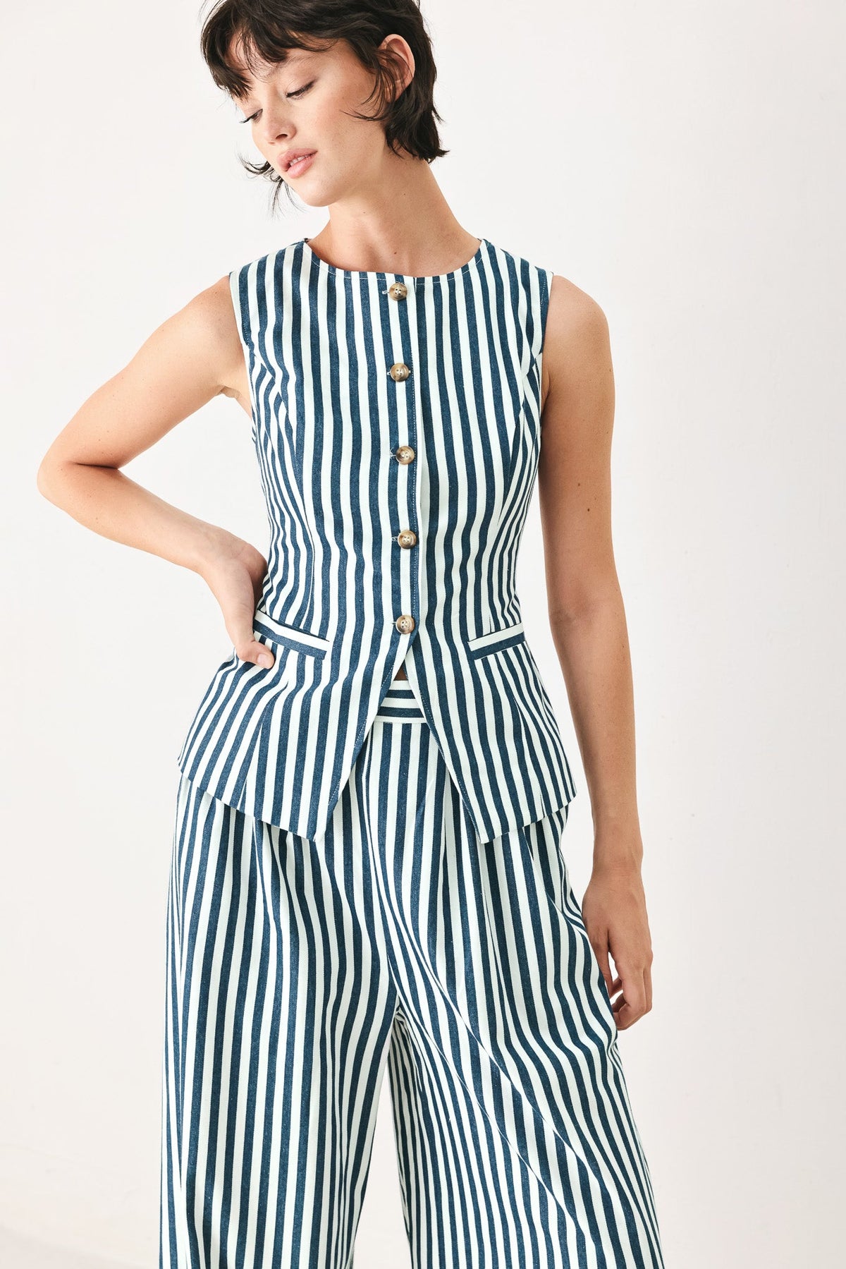 a woman in a striped dress