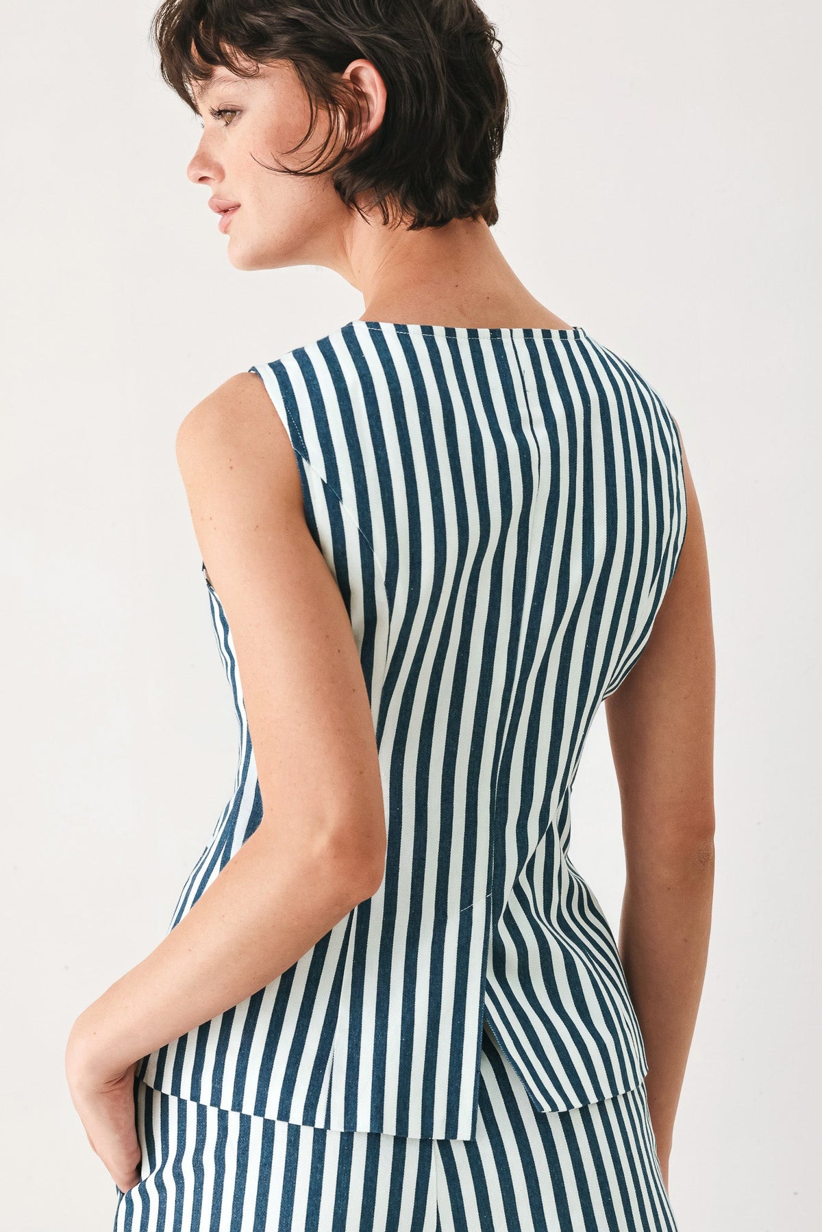 a woman in a striped dress