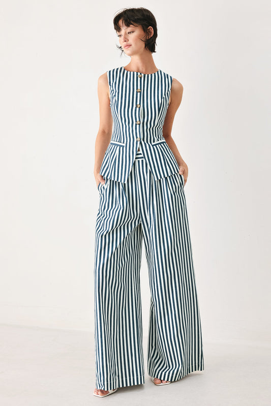 a woman in a striped jumpsuit