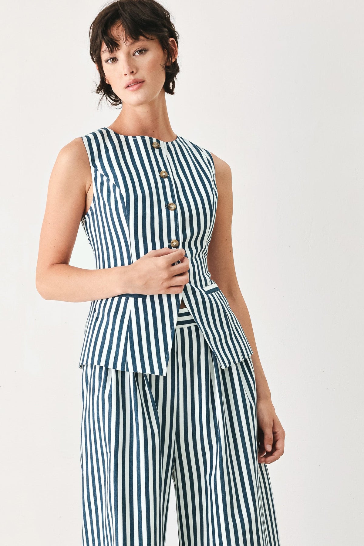 a woman in a striped outfit