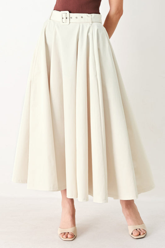 a woman wearing a white skirt