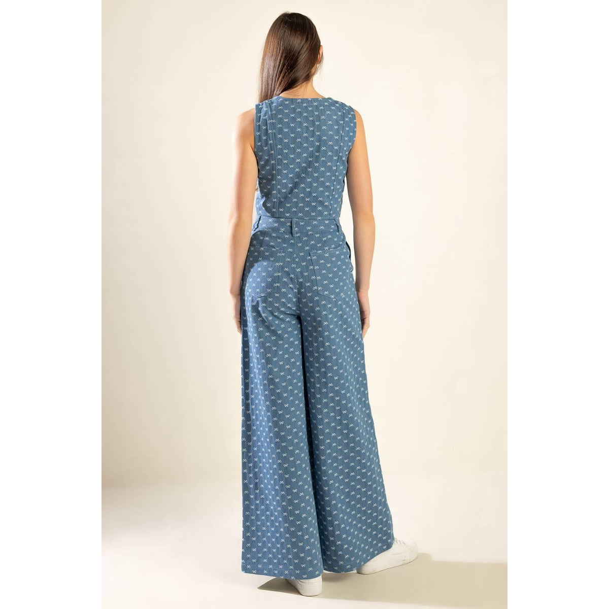 a woman in a blue jumpsuit