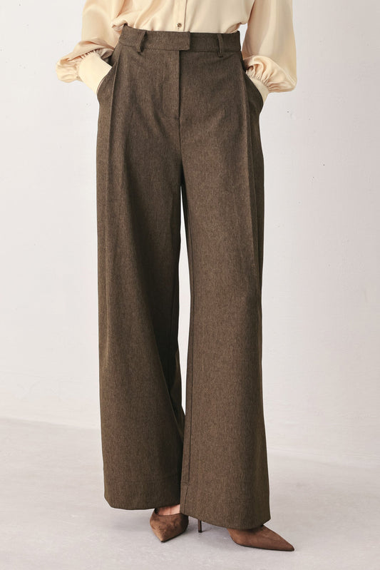 a brown pants with a white background