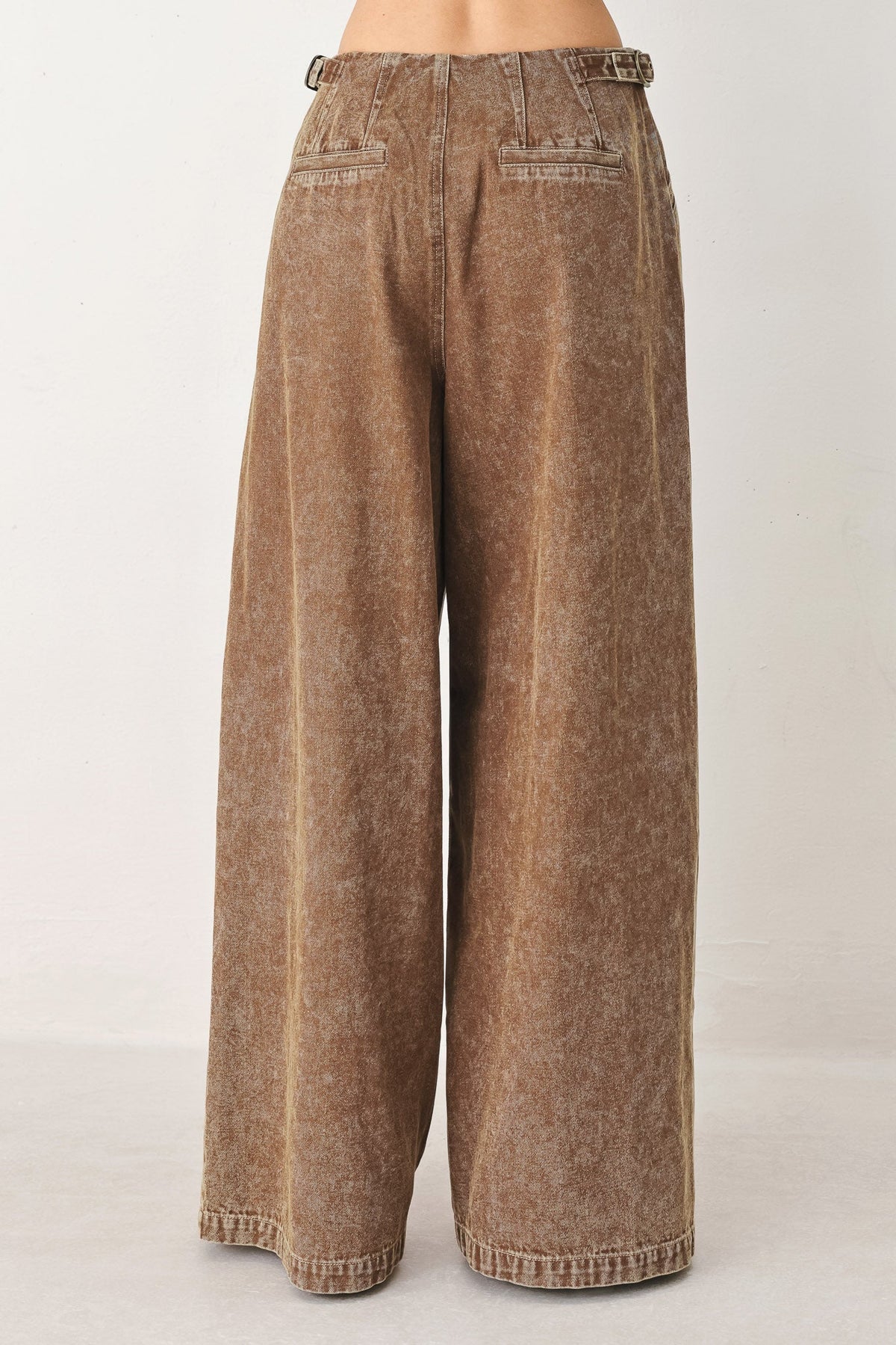 a brown pants with a white background