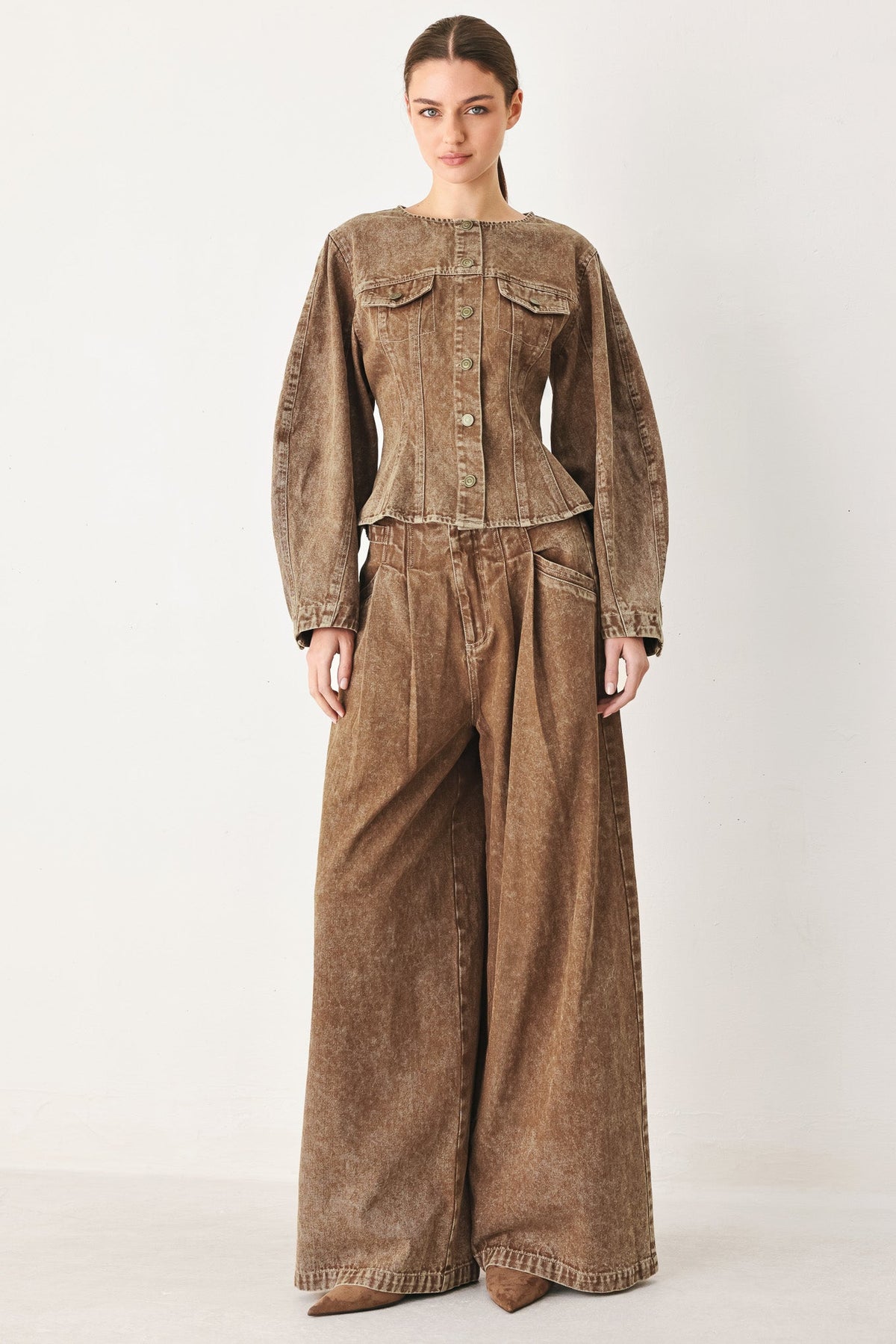 a woman wearing a brown outfit