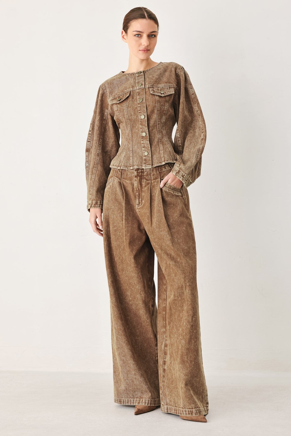 a woman in a brown outfit