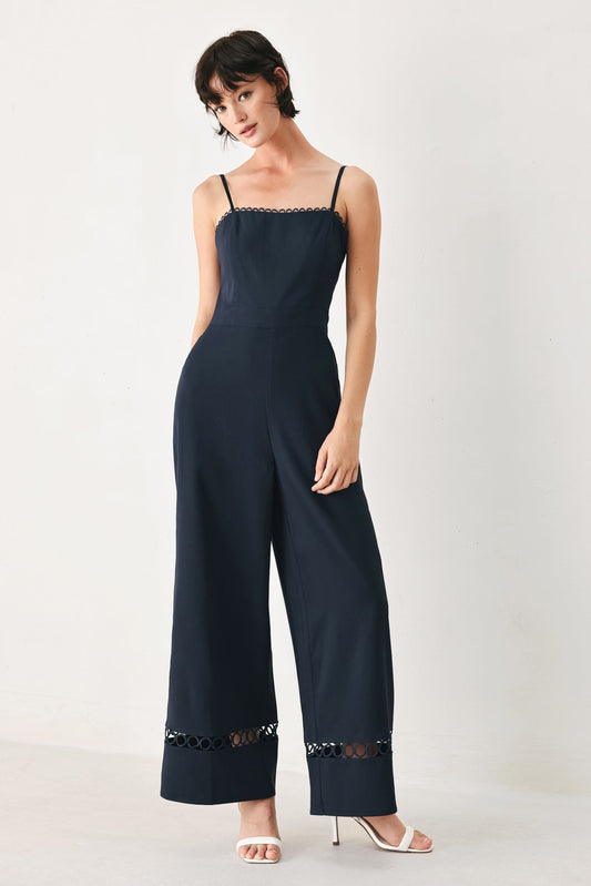 a woman in a black jumpsuit