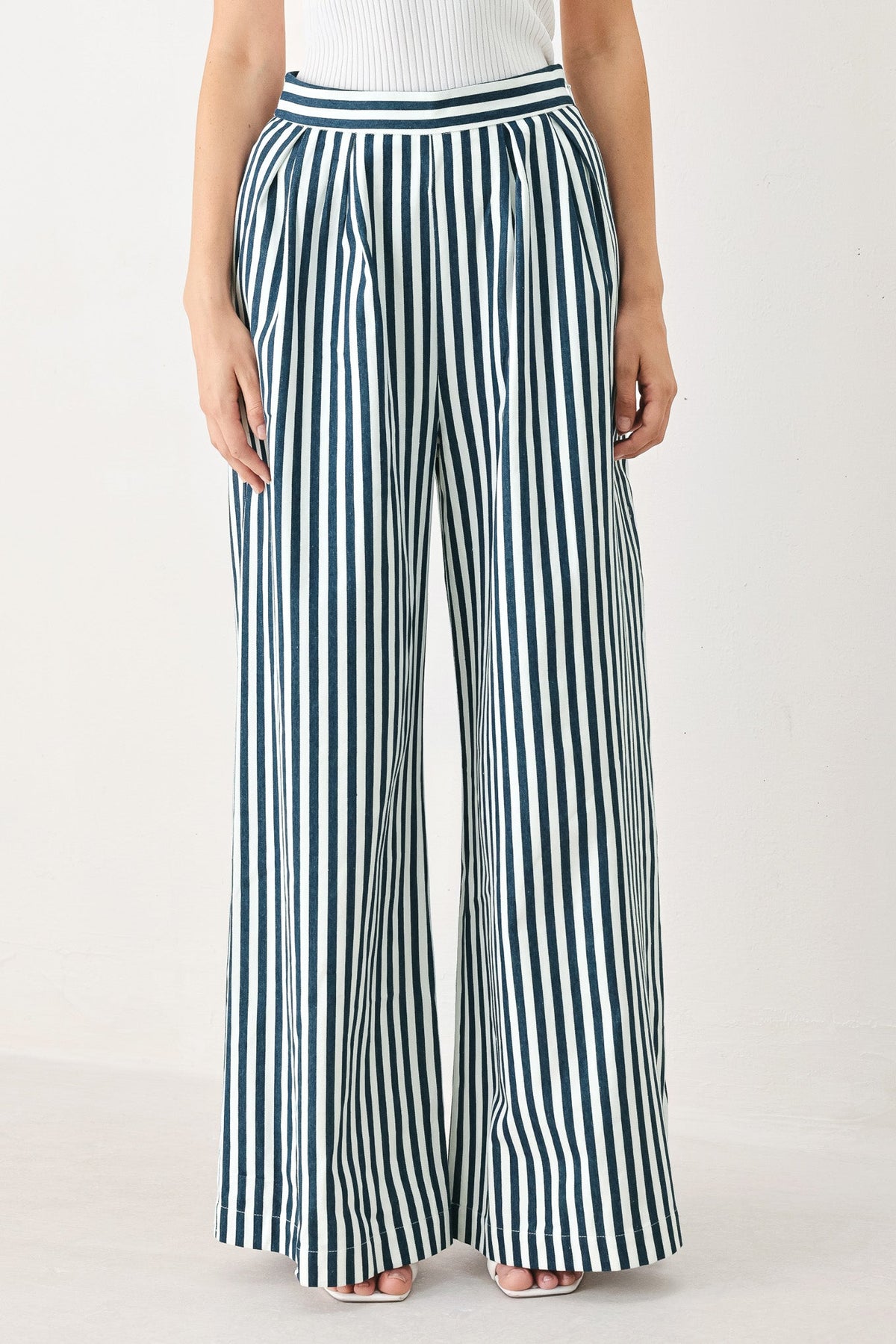 a person wearing a striped pants