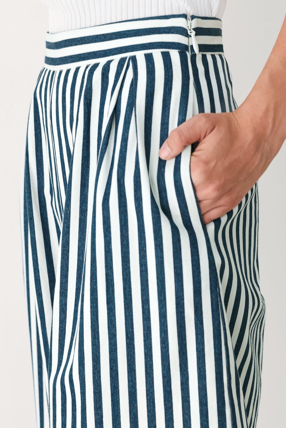 a person wearing a striped skirt