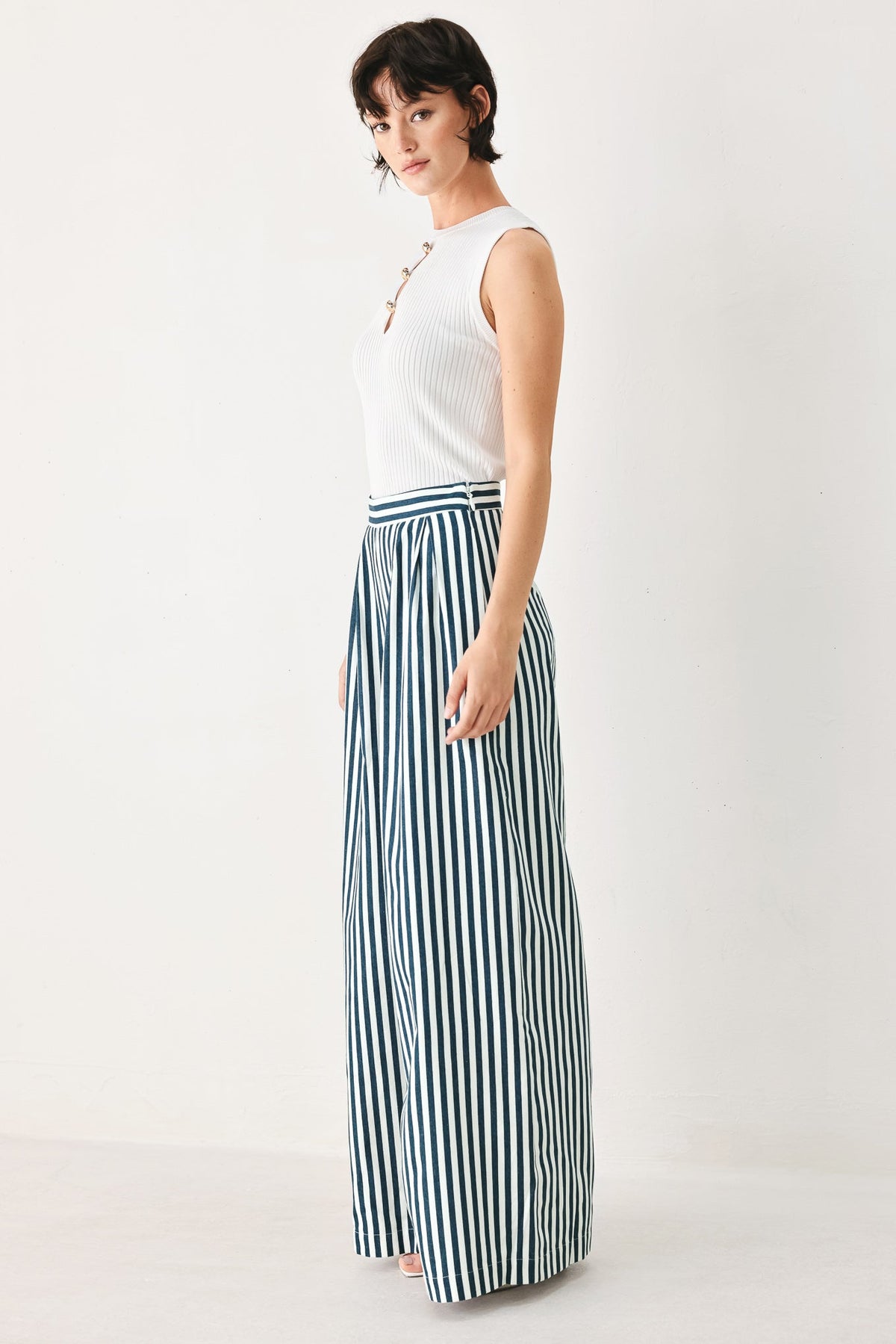 a woman in a striped skirt