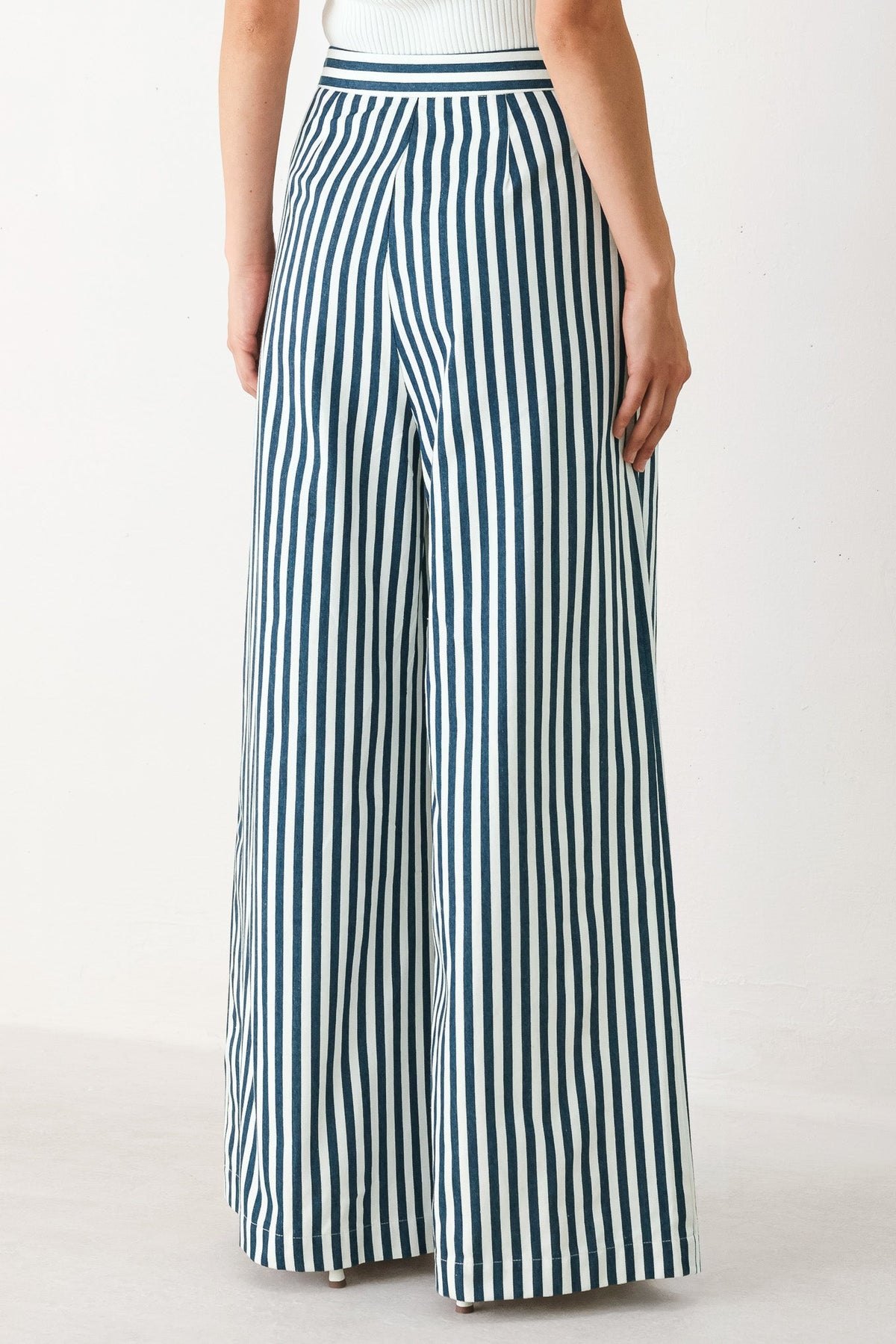 a person wearing a striped pants