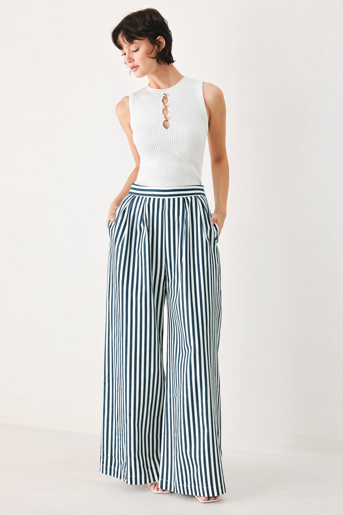 a woman in a striped pants