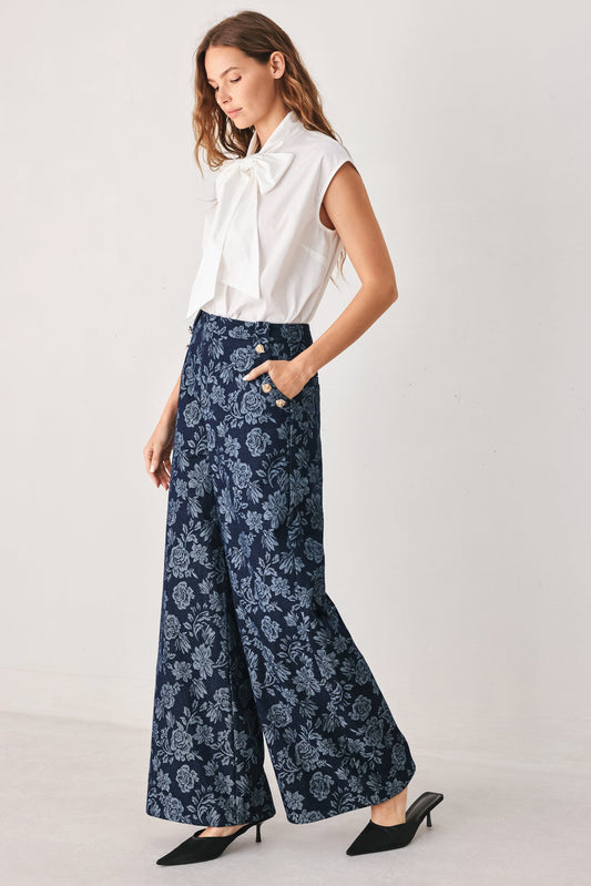 a woman in a white shirt and blue pants
