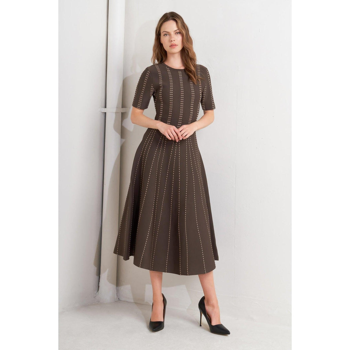 a woman in a brown dress
