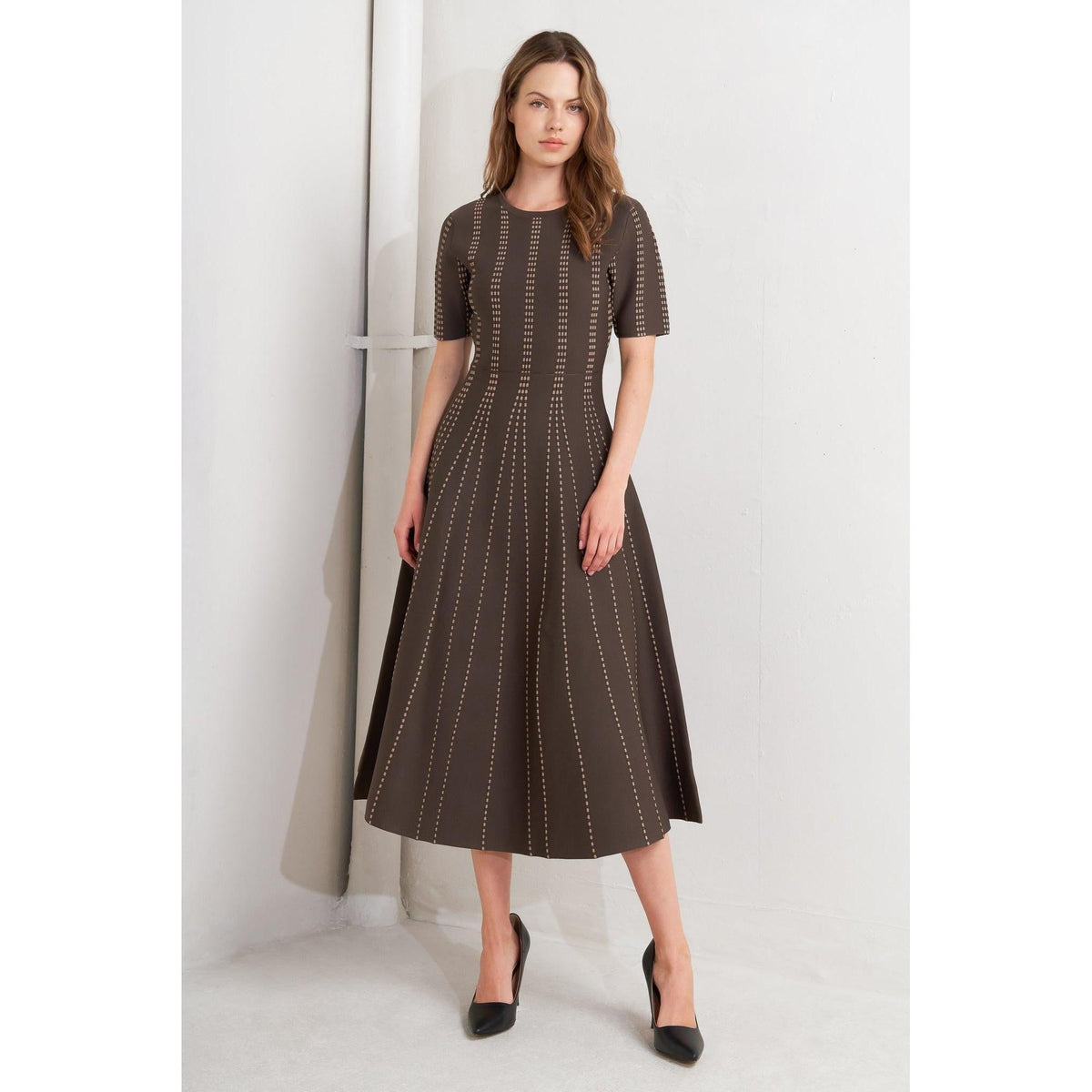 a woman in a brown dress