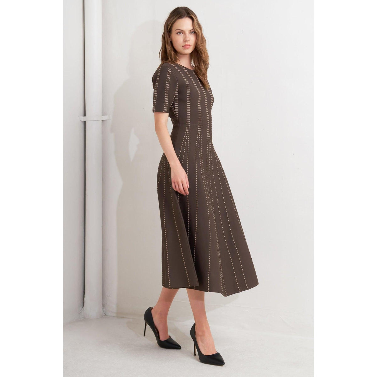 a woman in a brown dress