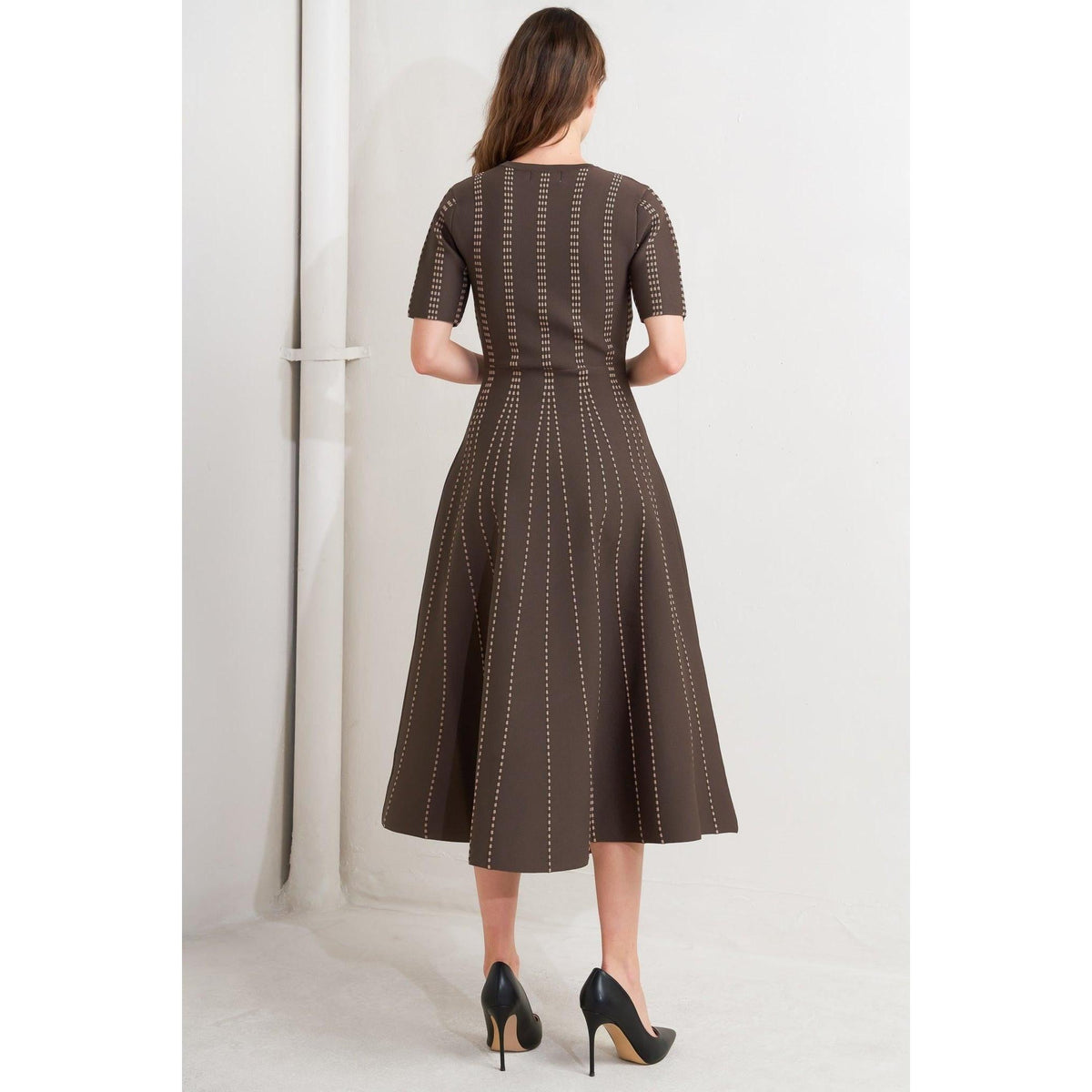 a woman in a brown dress