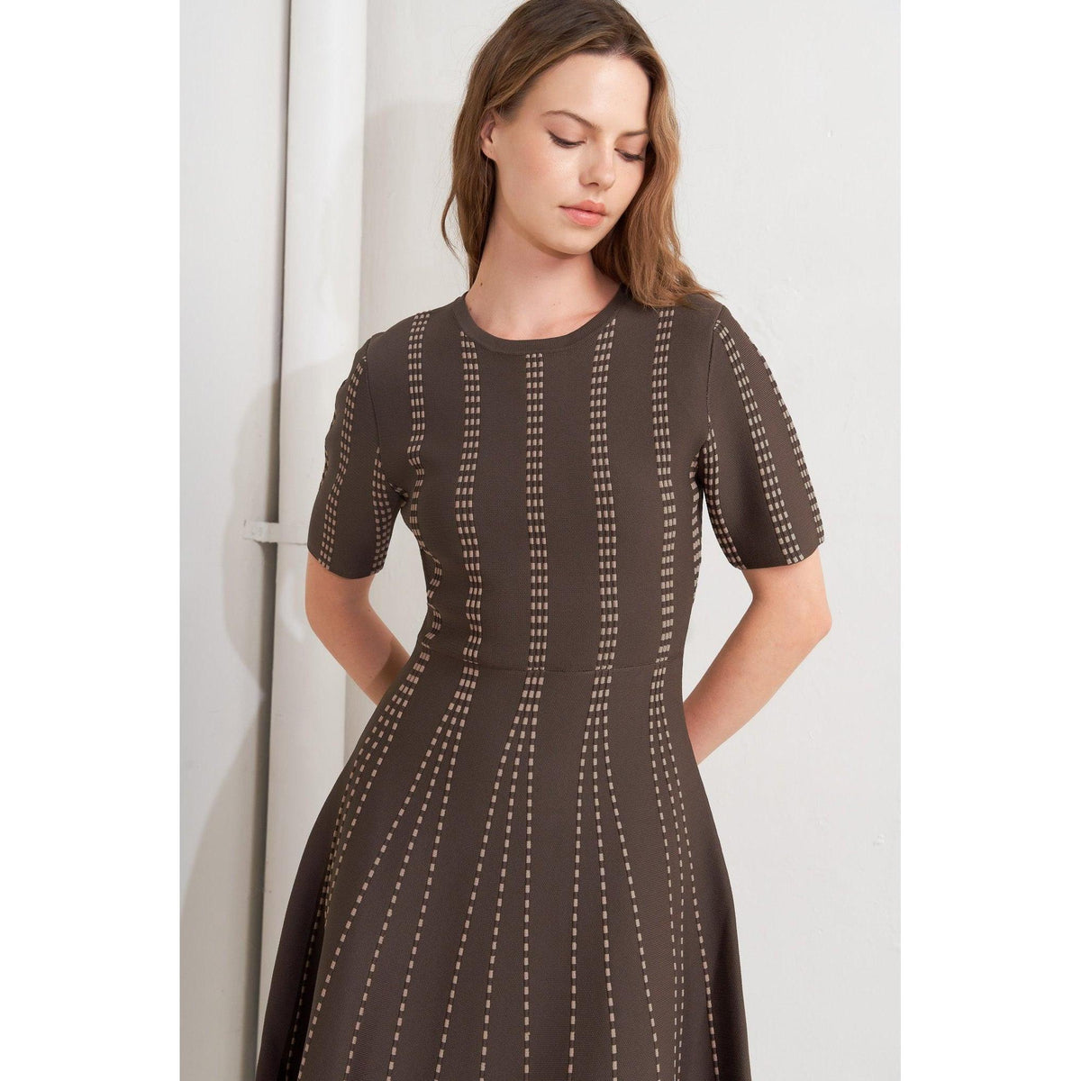 a woman in a brown dress