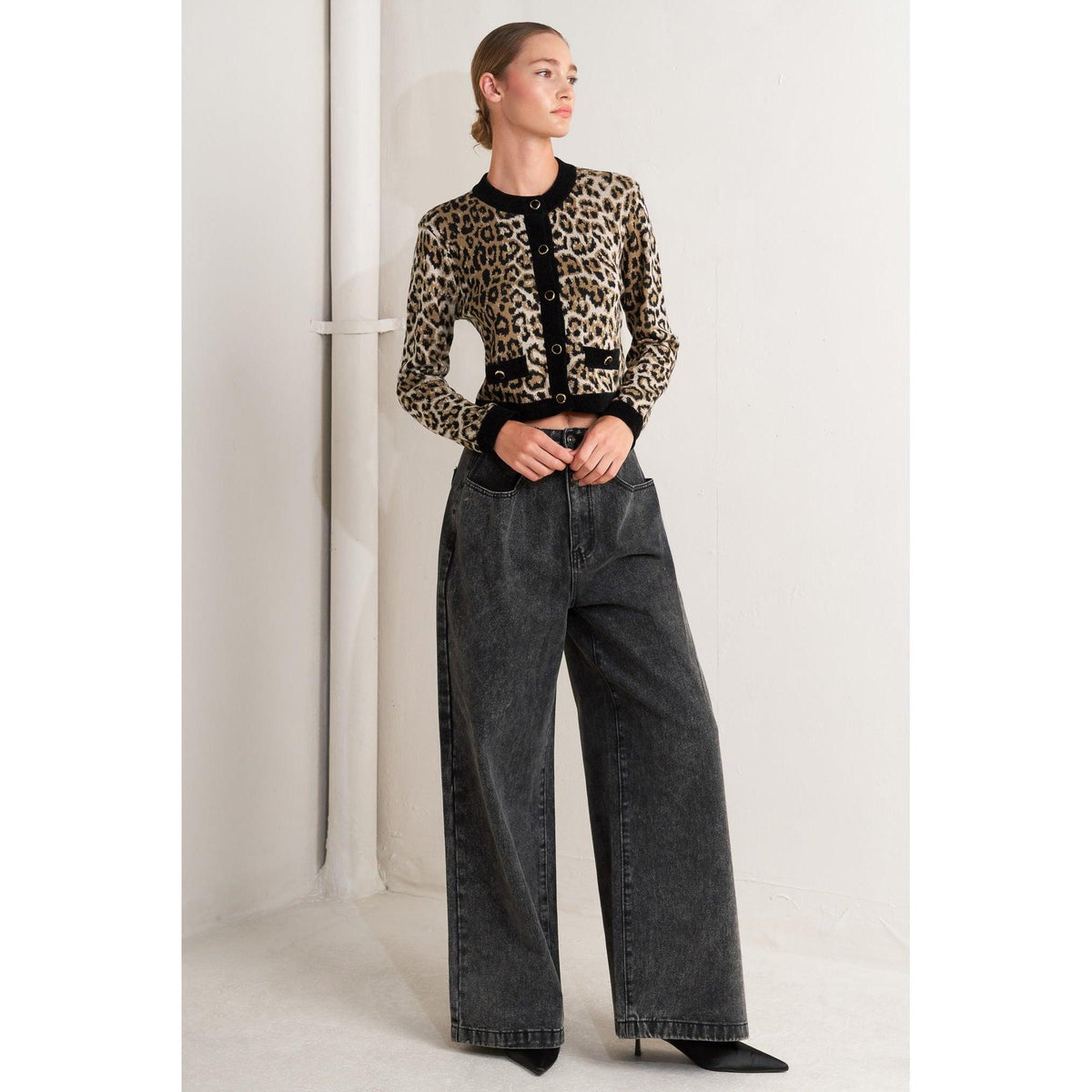 a woman in a leopard print sweater