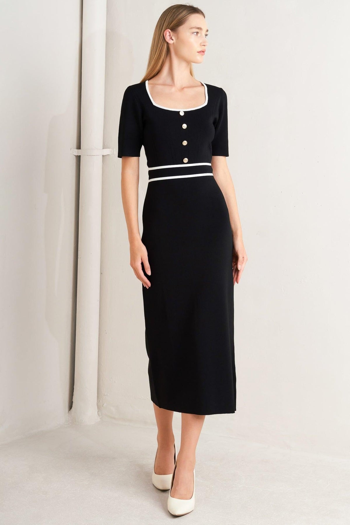 a woman in a black dress