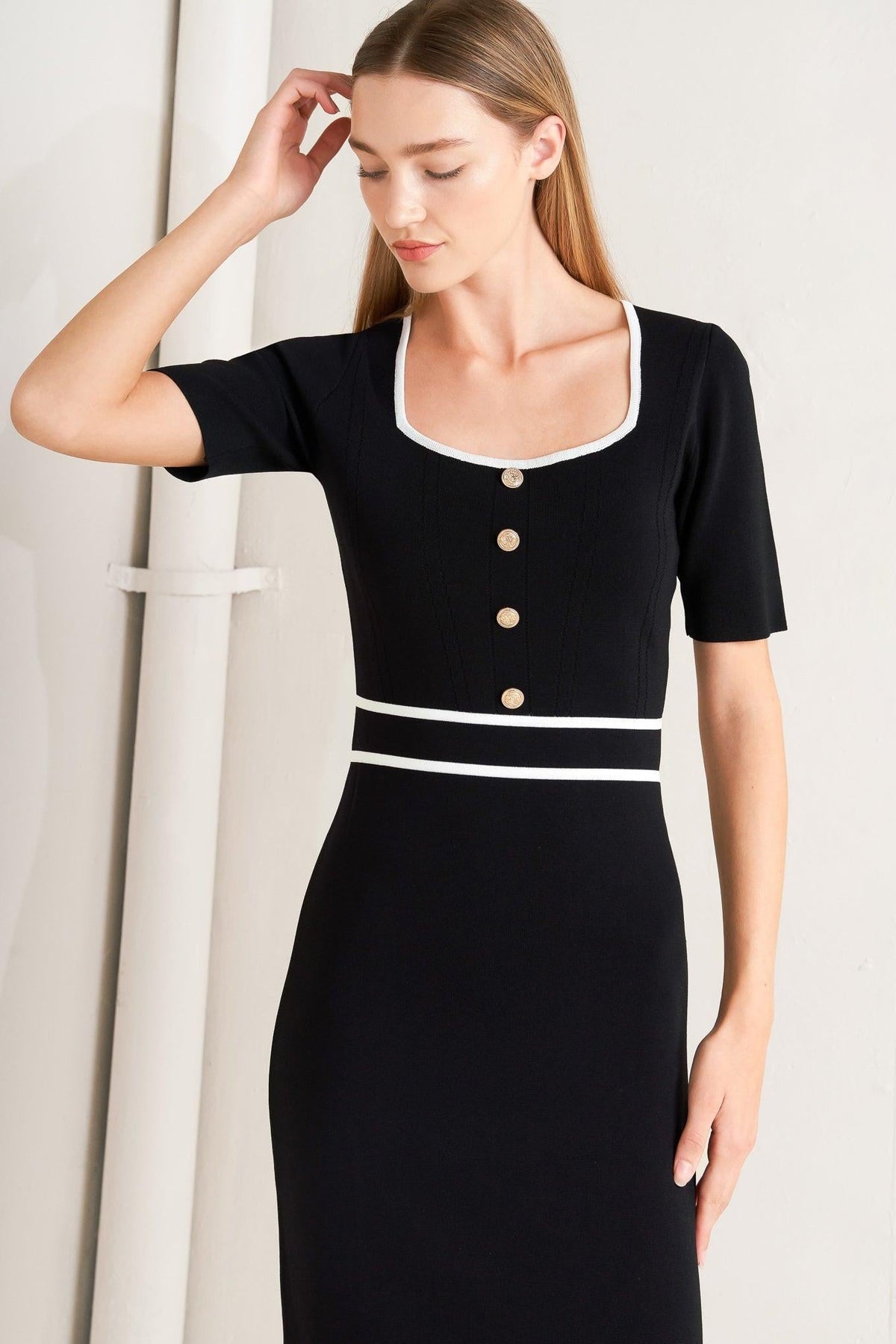 a woman in a black dress